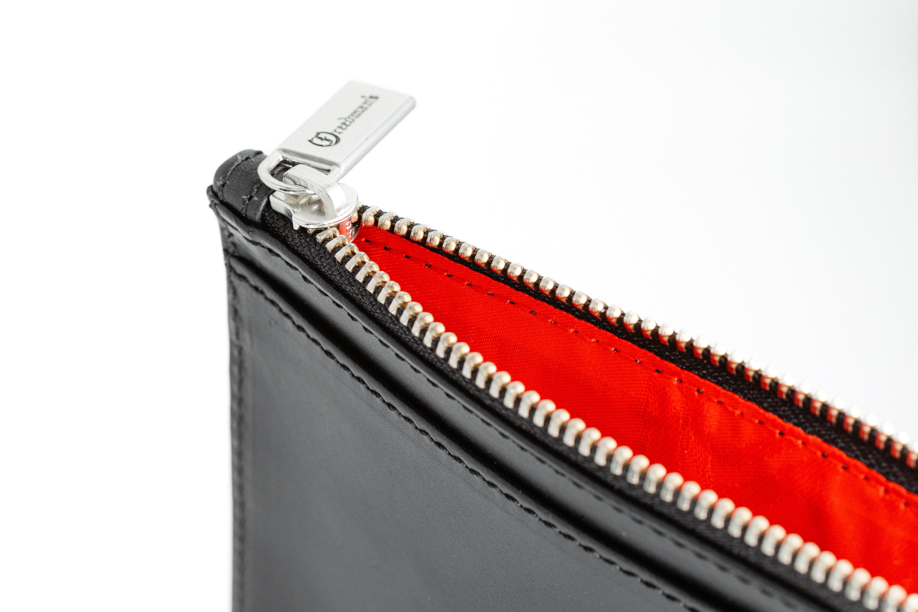 Detail of Freedman's Zip Top Wallet: Smooth Zipper Closure and Vibrant Interior Lining, Black Leather