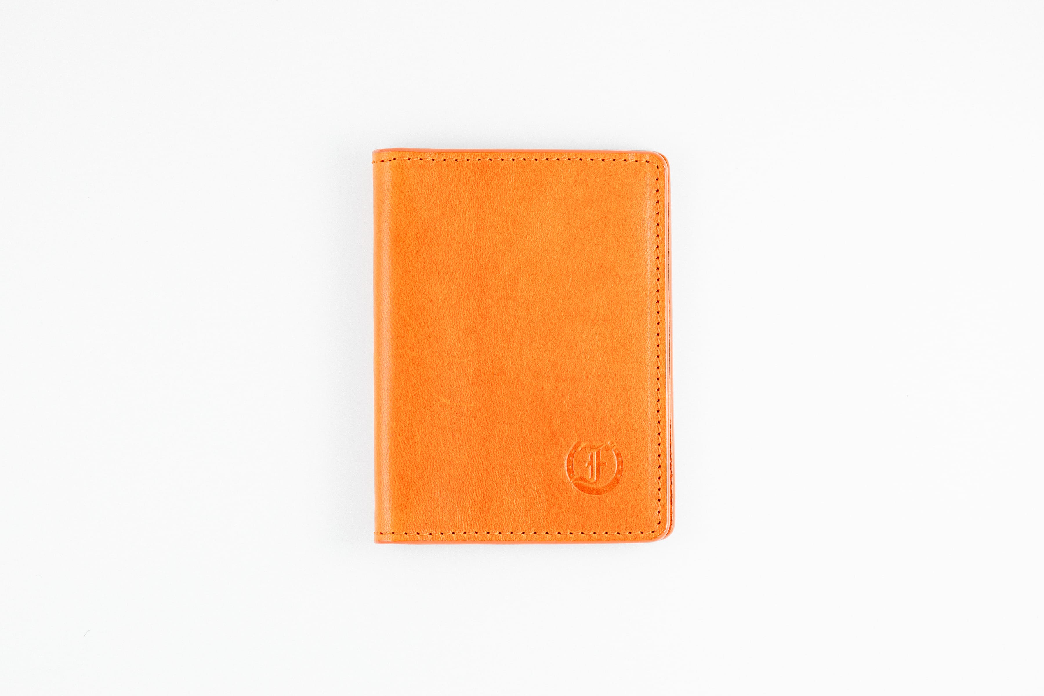 Freedman's Credit Card Holder: Slim and Durable Wallet, Close-Up on Leather Texture and Stitching- Orange