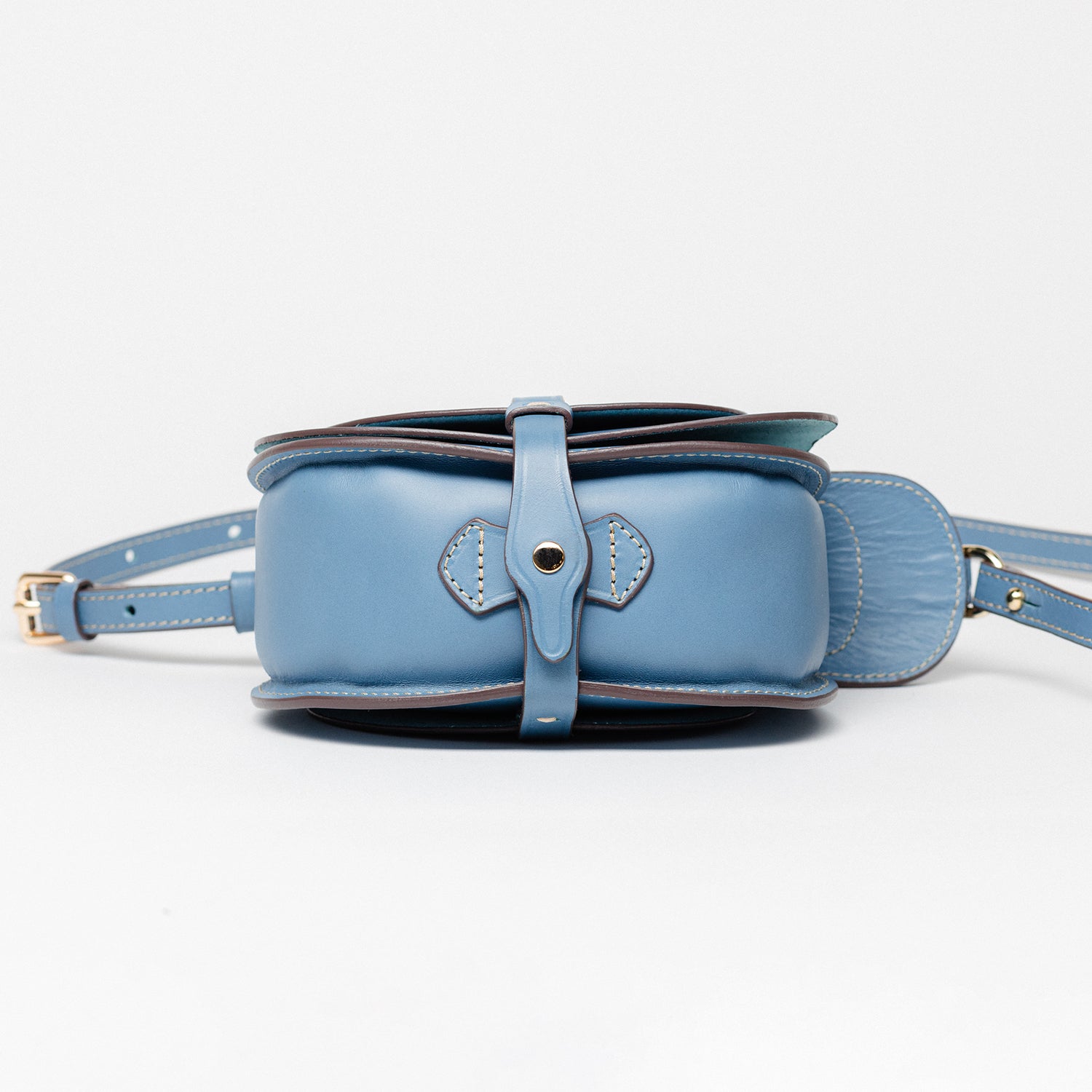 Side View of Freedman's Blue Leather Derby Shoulder Bag: Saddle-Inspired Flap Closure and Detailed Stitching