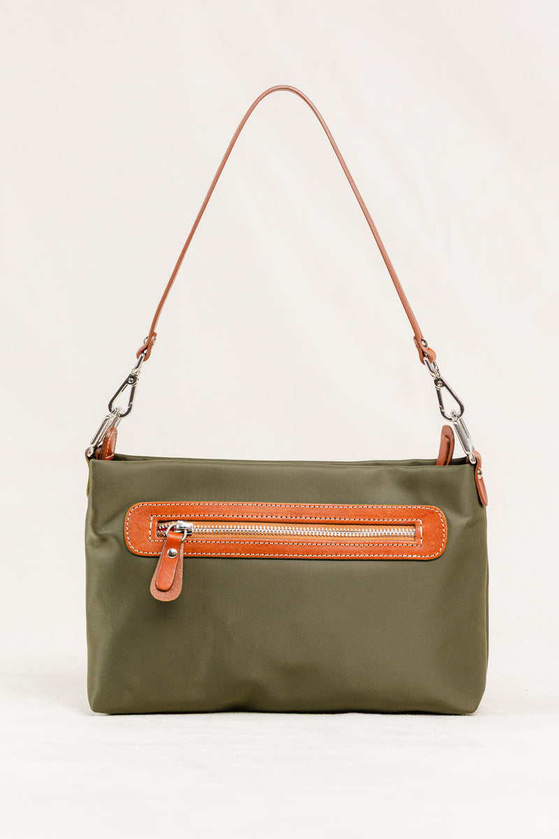 Dokar Bag by Freedman's, close-up of the olive green crossbody bag showing the back zippered pocket with brown leather trim, a thin brown leather shoulder strap, and silver hardware.