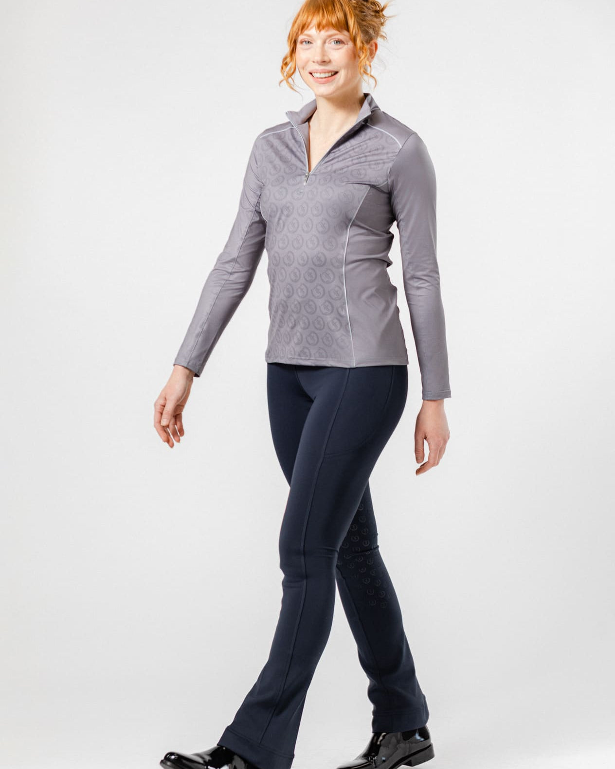 Woman Modeling Complete Freedman's Equestrian Look: Platinum Echo Shirt, Navy Jods, and Jodhpur Boots