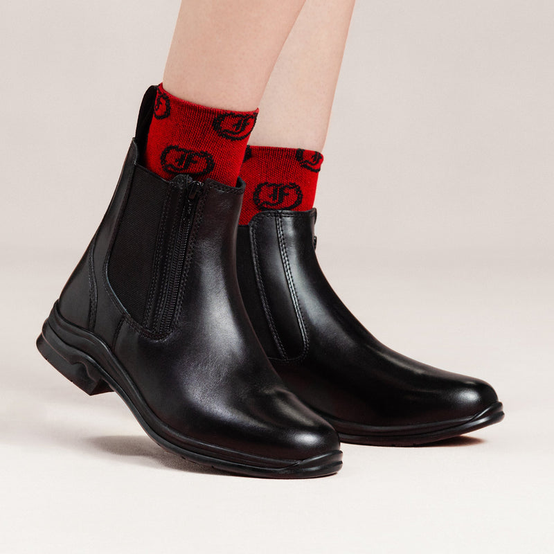 Freedman's Pisgah Jodhpur Boot, black leather, styled with red patterned socks, showcasing the boot's design.