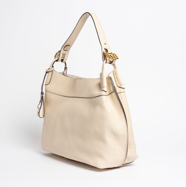 Side view of Wetherby Tote by Freedman Harness – Putty leather shoulder bag with adjustable strap, gold buckle hardware, and sleek minimalist design