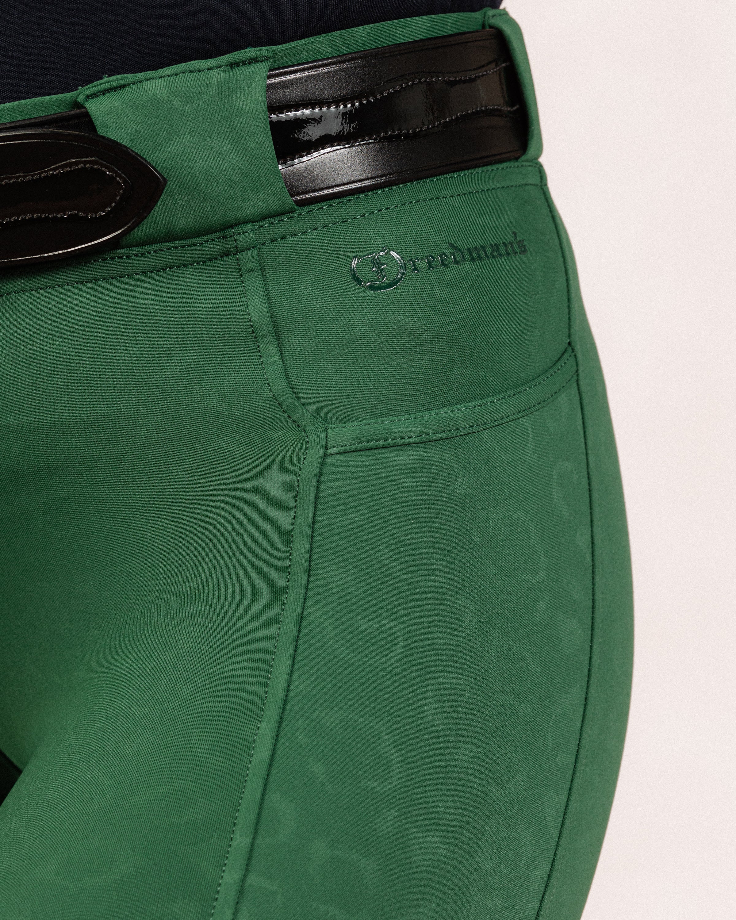 Green Cheetah Jods with a visible Freedman’s logo on a light background, made by Freedman’s Harness.