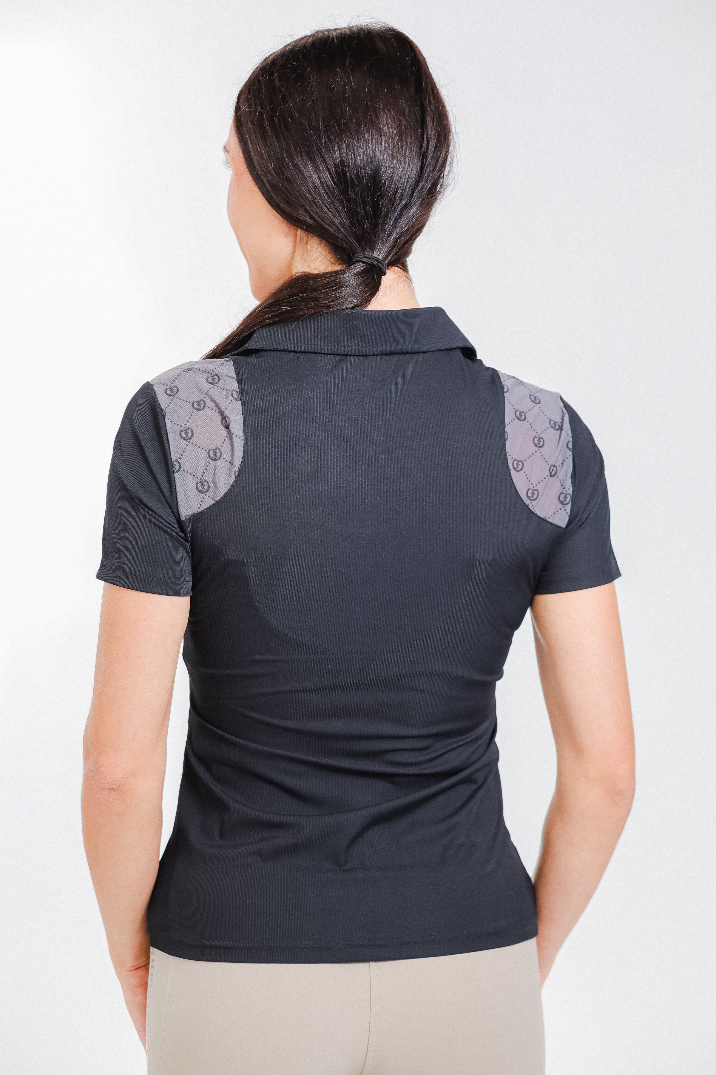 Back view of Freedman's Ladies' 1/4 Zip Polo, black with patterned shoulder details.