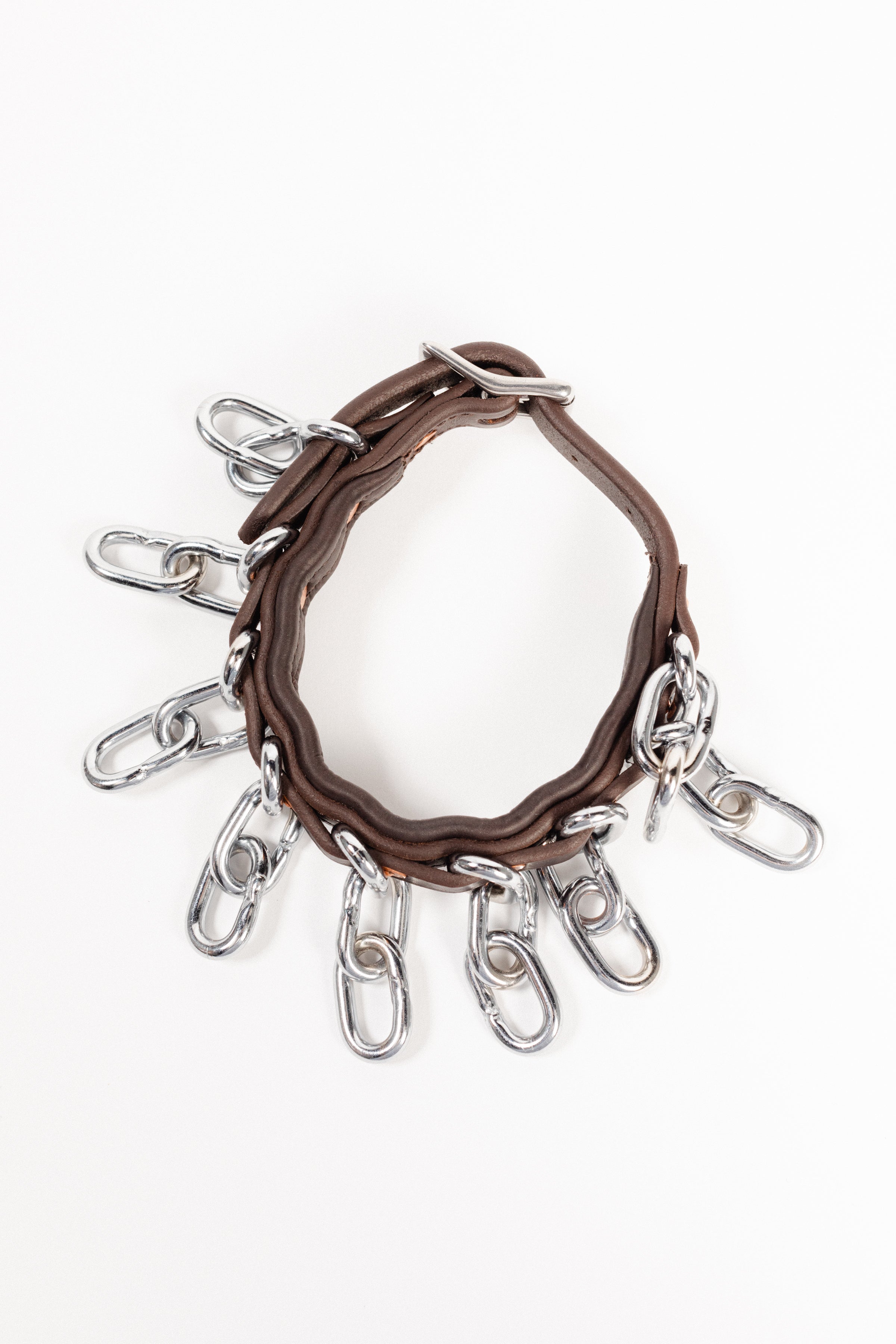 Close-up of ACTraining ankle action chain straps showing leather, buckles, and hanging chains. Image taken from the top