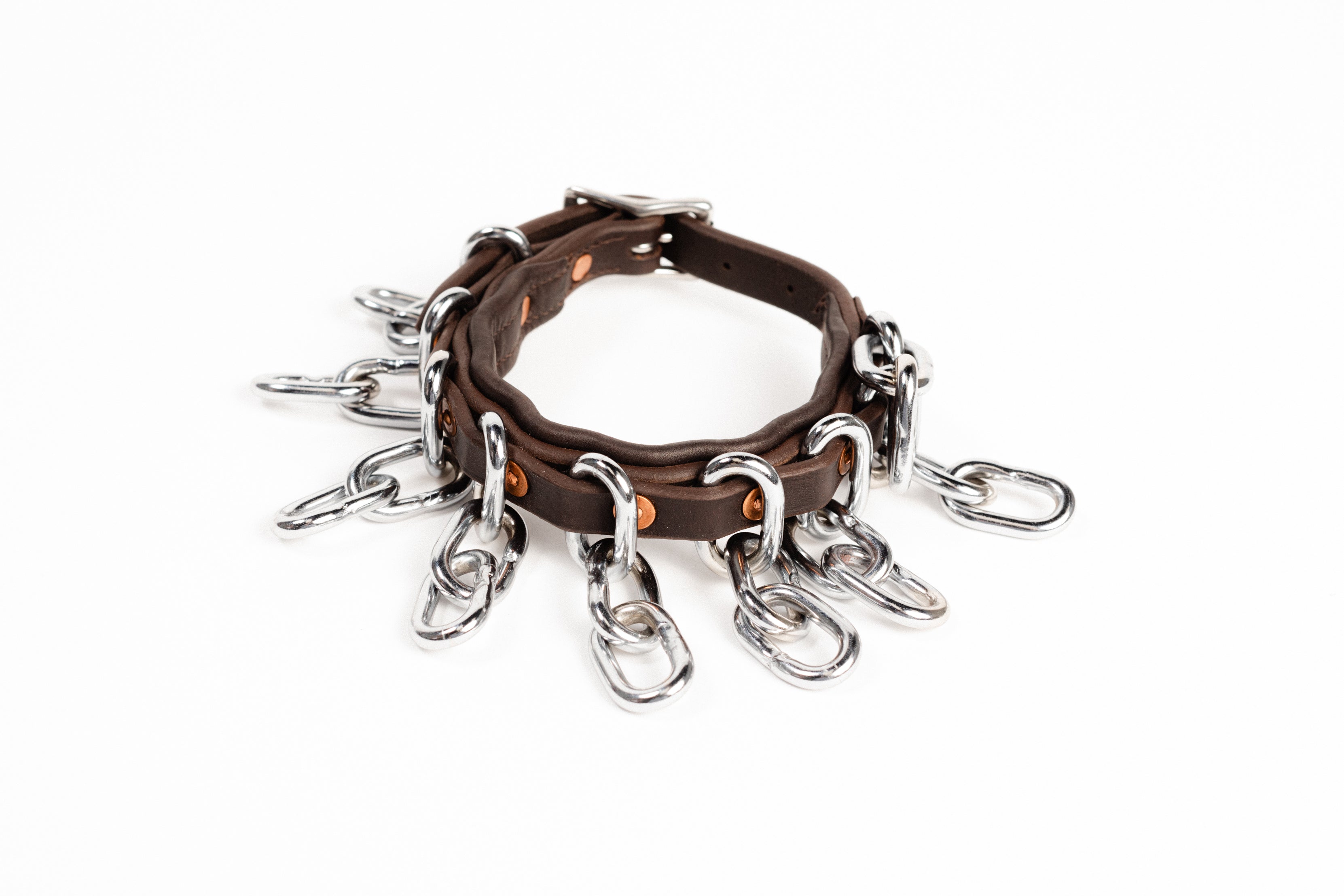 Close-up of ACTraining ankle action chain straps showing leather, buckles, and hanging chains. Single Silo