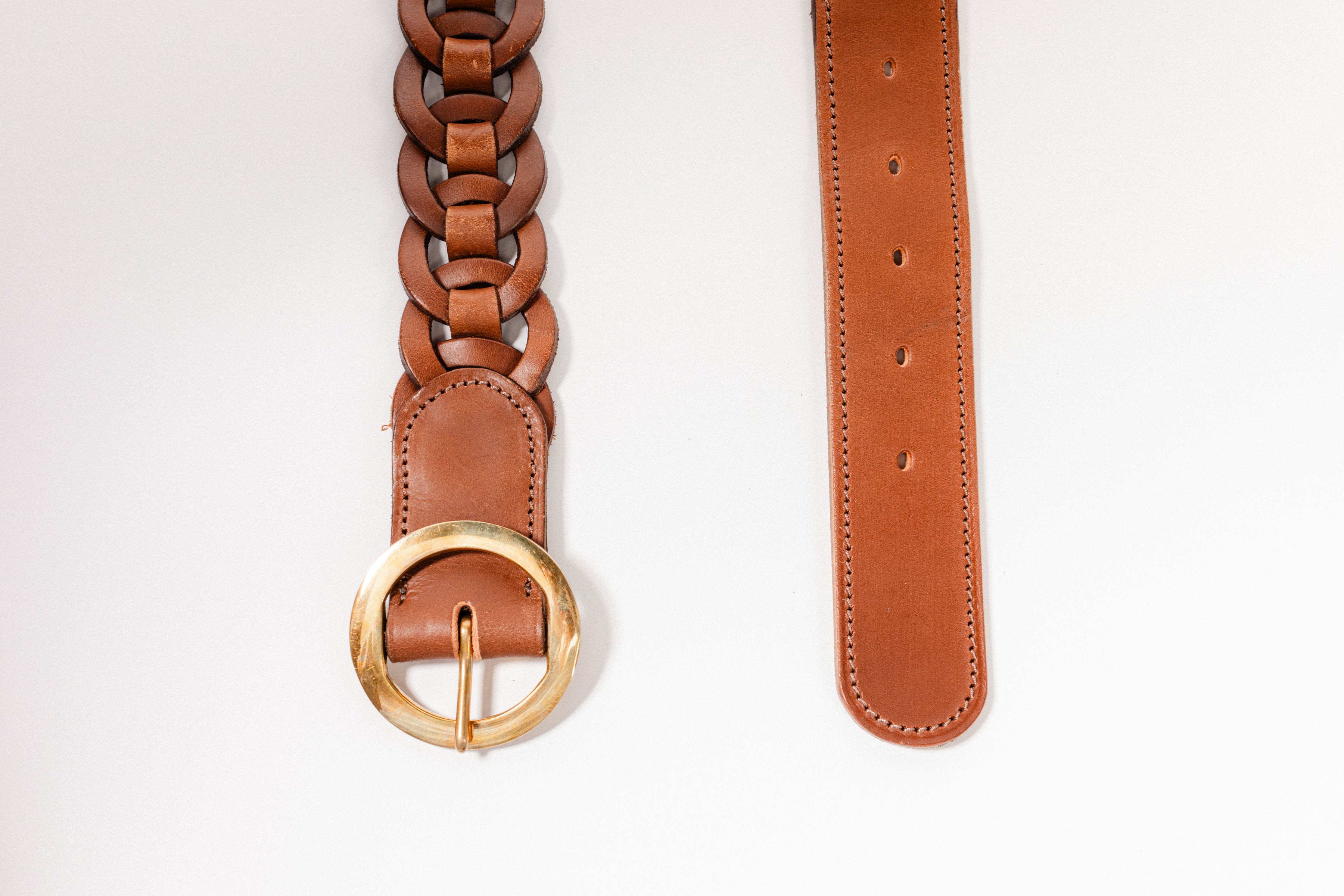 Close-up of brown leather Small Leather Ring Belt by Freedman's showing braided detail, gold oval buckle, and belt loop, on a white background.