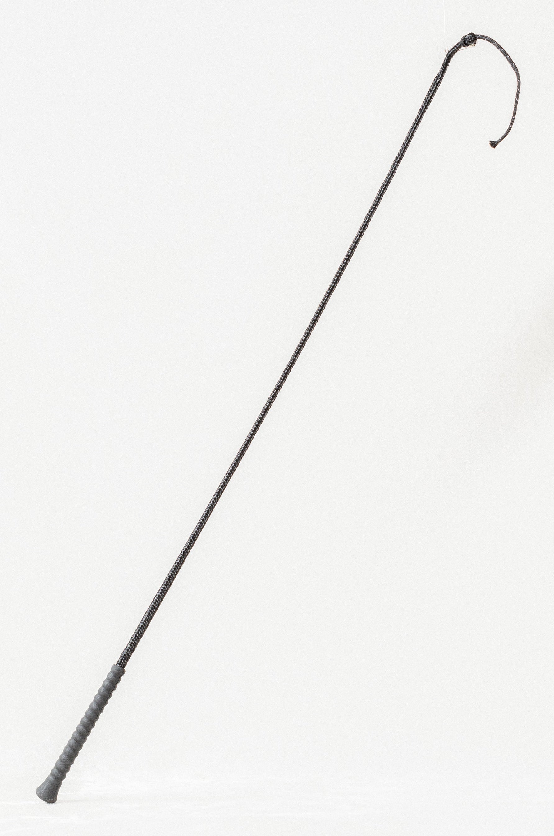 Full view of a Nylon Wrapped Riding Crop with a textured grip and braided shaft.
