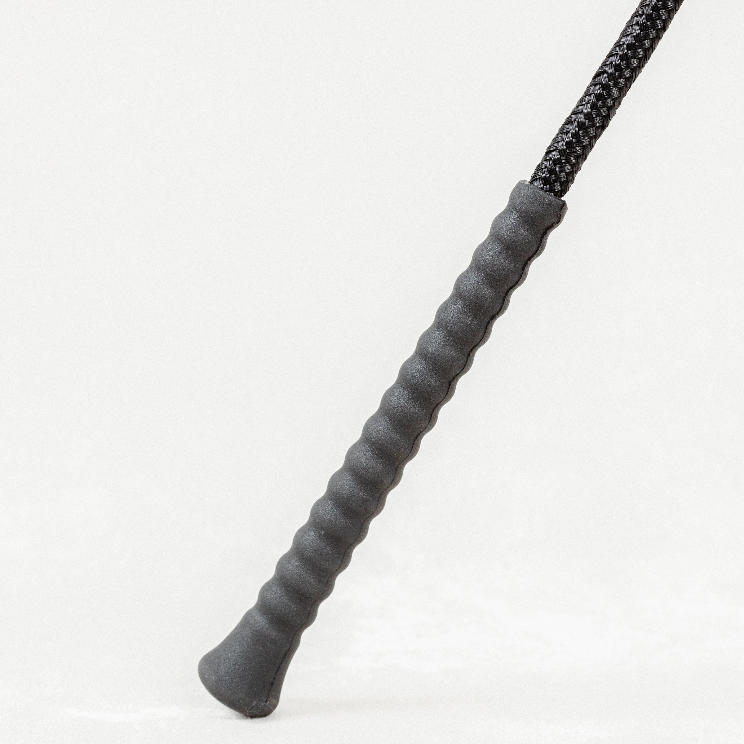 Close-up of Nylon Wrapped Riding Crop with textured grey grip.