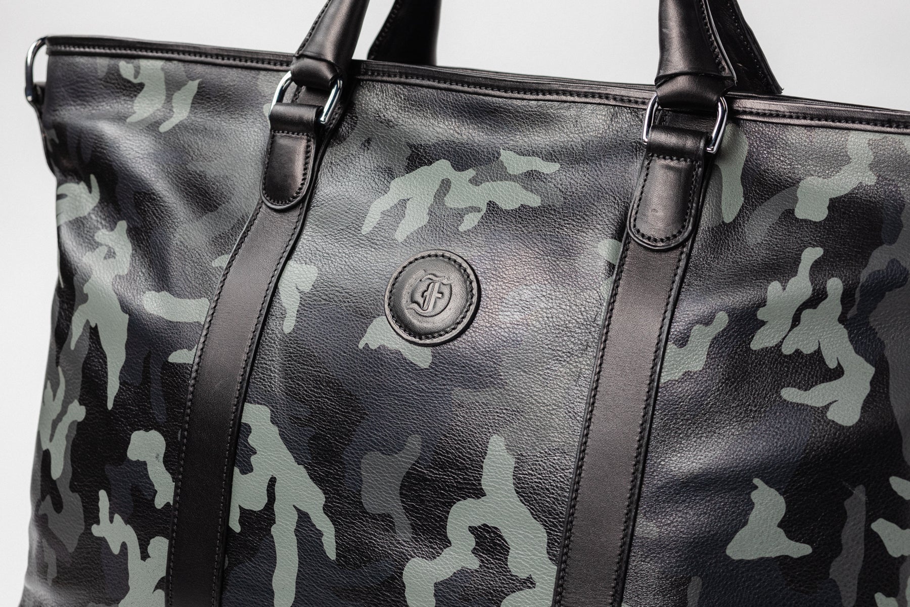 Freedman's Victoria Tote Large, close-up of embossed logo, handles, and camouflage pattern.