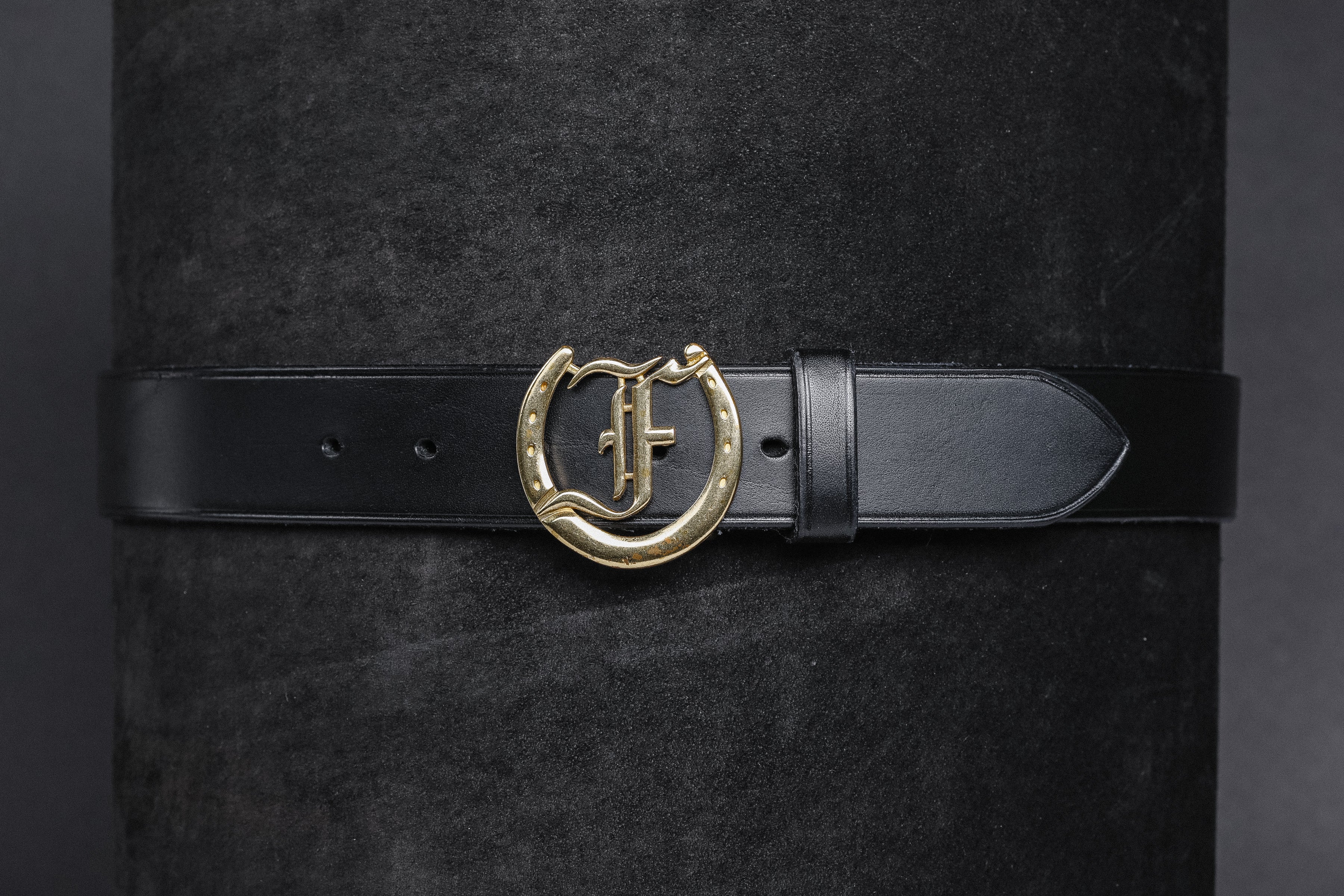 Freedman's Signature Logo Belt: Black Leather Belt with Silver Horseshoe Buckle and Embossed Brand Logo