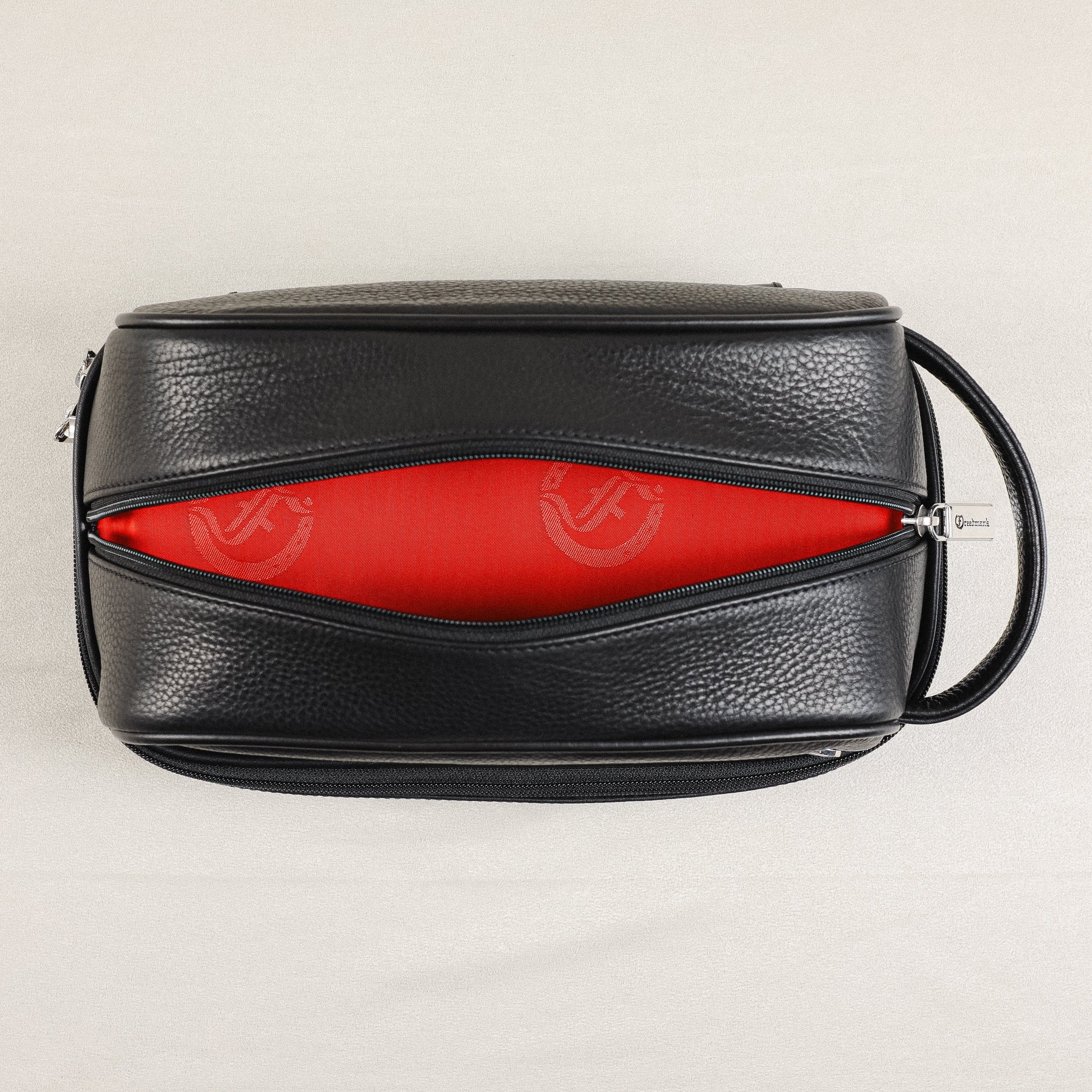 Freedman's Cardiff Shave Bag, Top View, Black Textured Leather Exterior, Dual Compartments Open, Bright Red Fabric Lining with Embossed "F" Logo Pattern