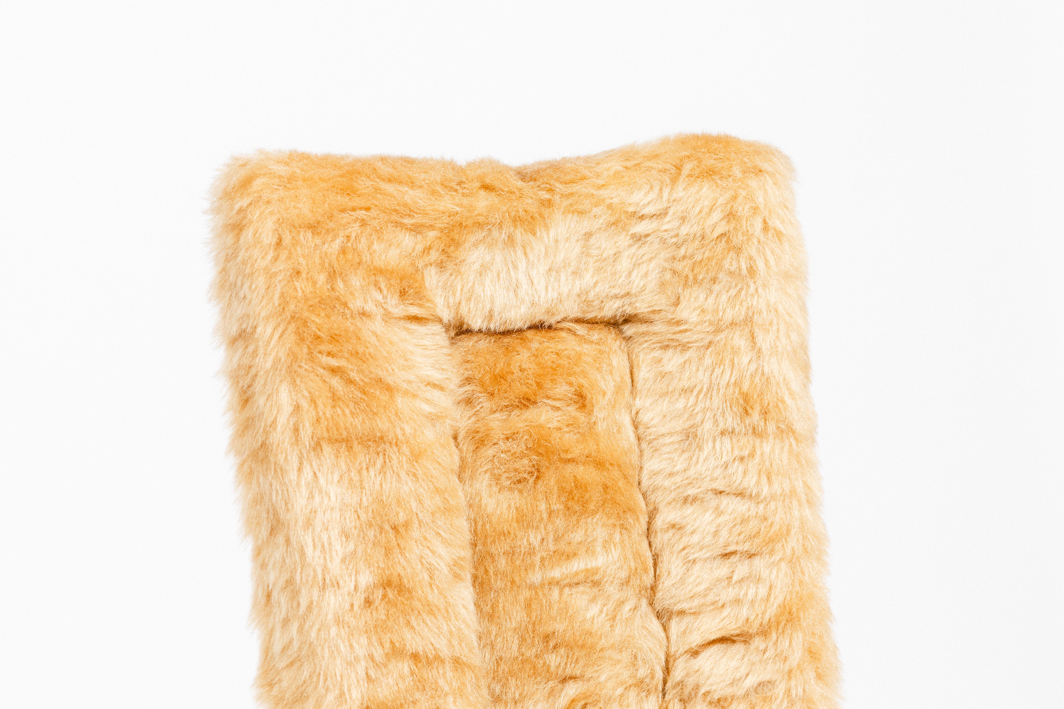 Black Fleece Back Pad by Freedman's, close-up of textured gold fabric