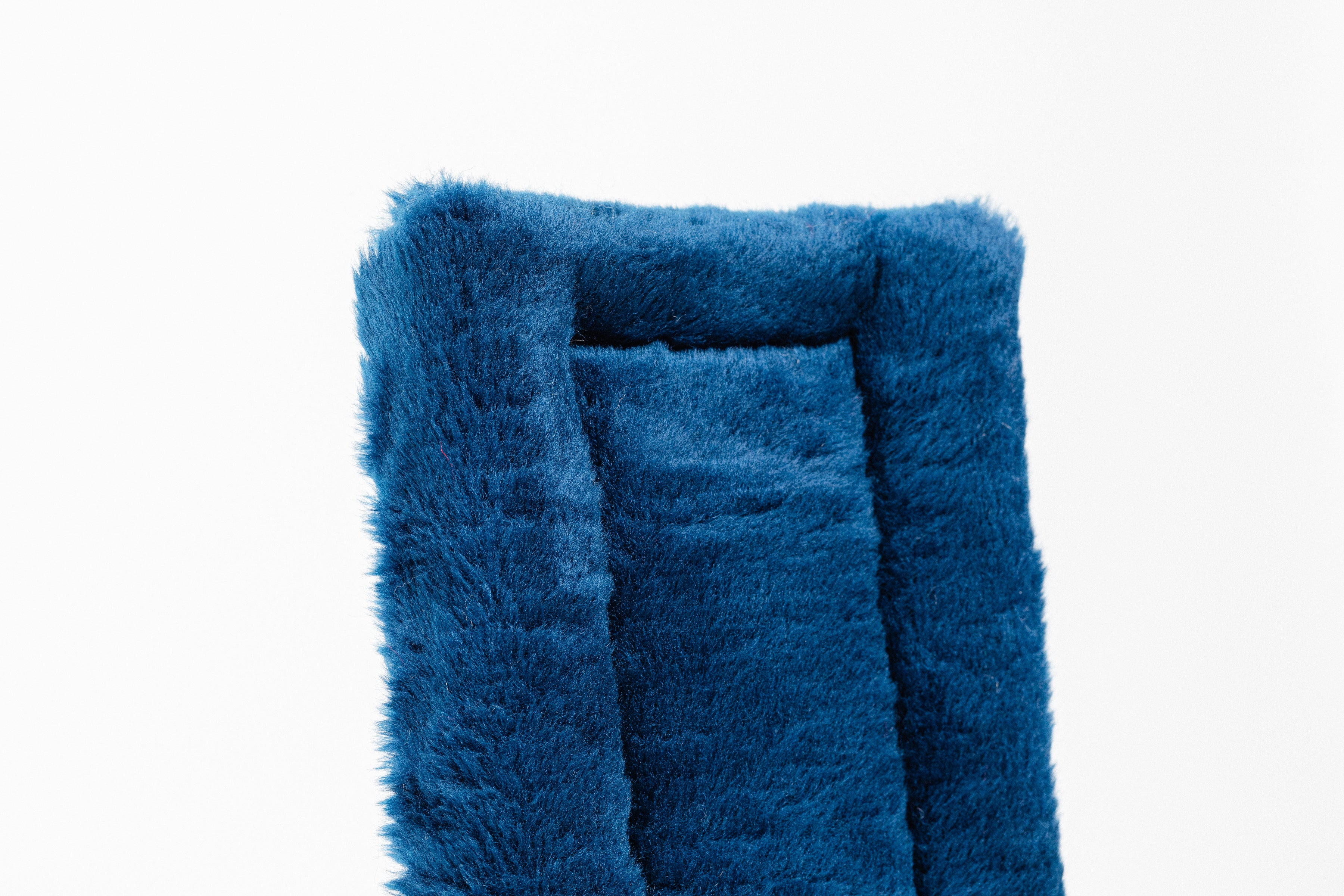 Black Fleece Back Pad by Freedman's, close-up of textured blue fabric"