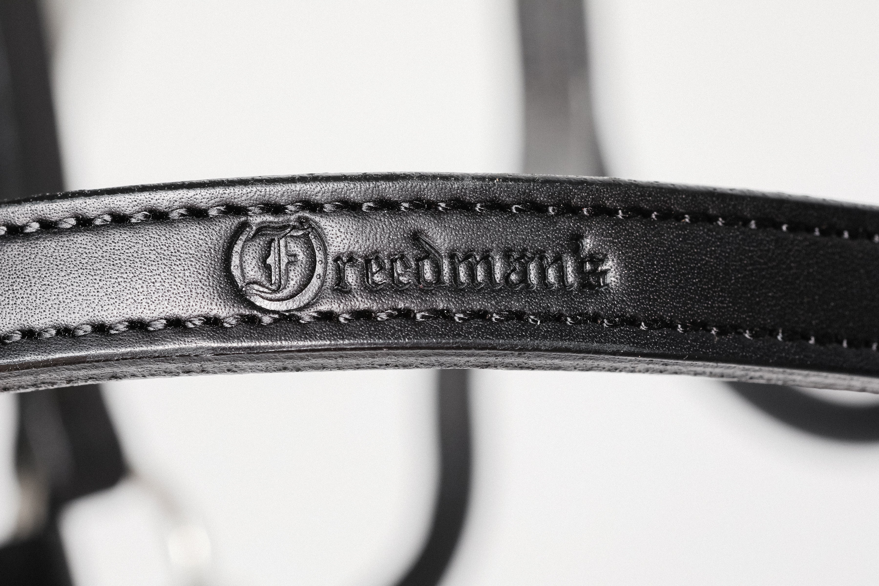 close-up of Freedman's Brand Logo on Black Leather Horse Halter
