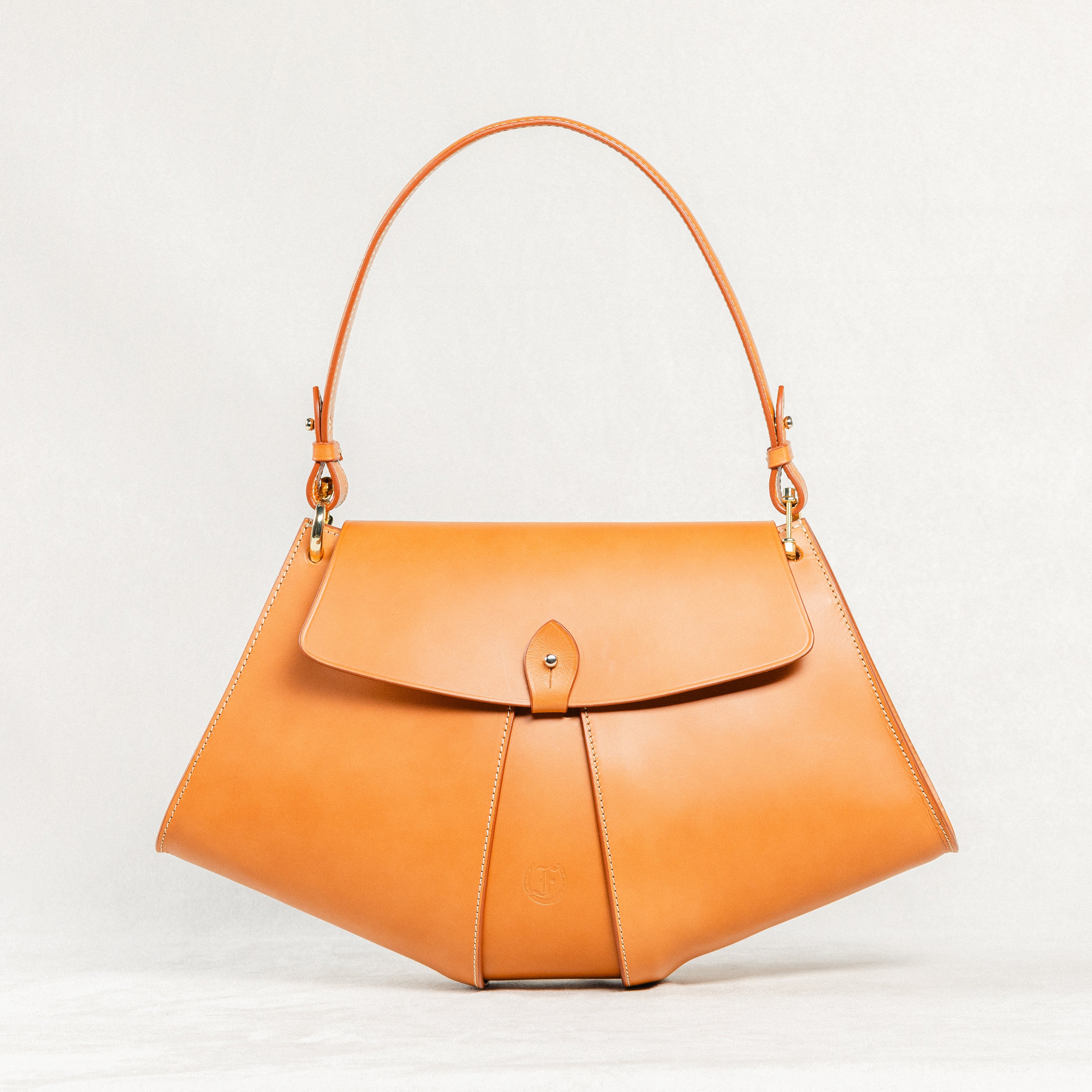 Cognac leather Moray Bag by Freedman's with unique trapezoid silhouette and long shoulder strap.