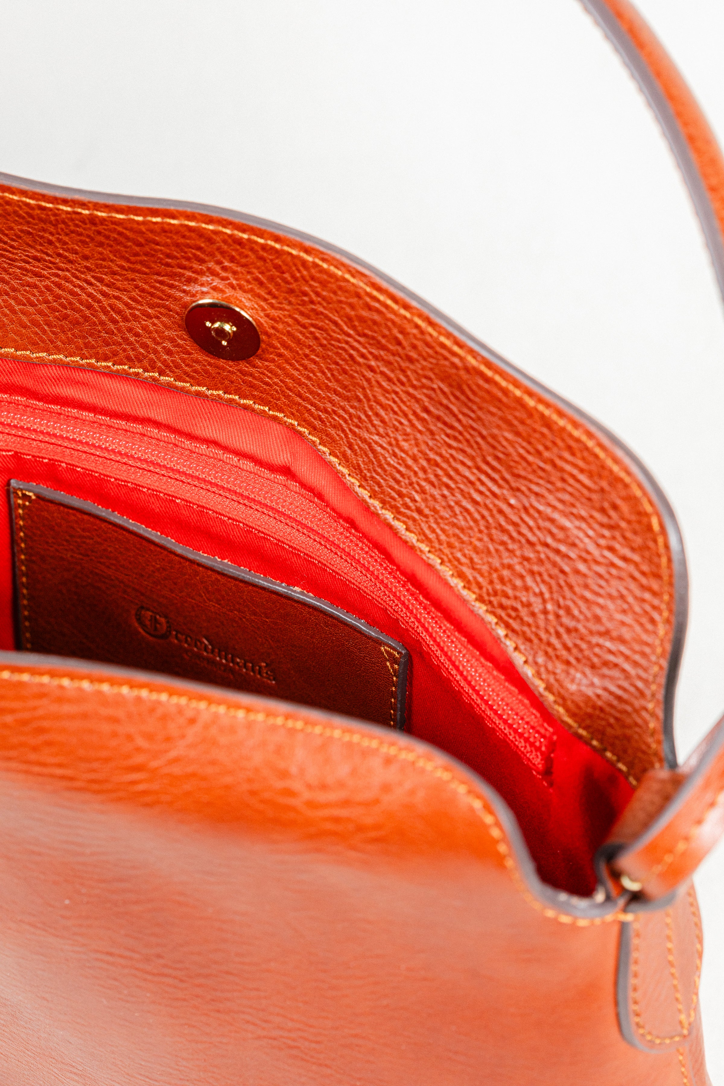 Close-up of Freedman's Murphy Bag Interior, Chestnut Leather and Red Fabric