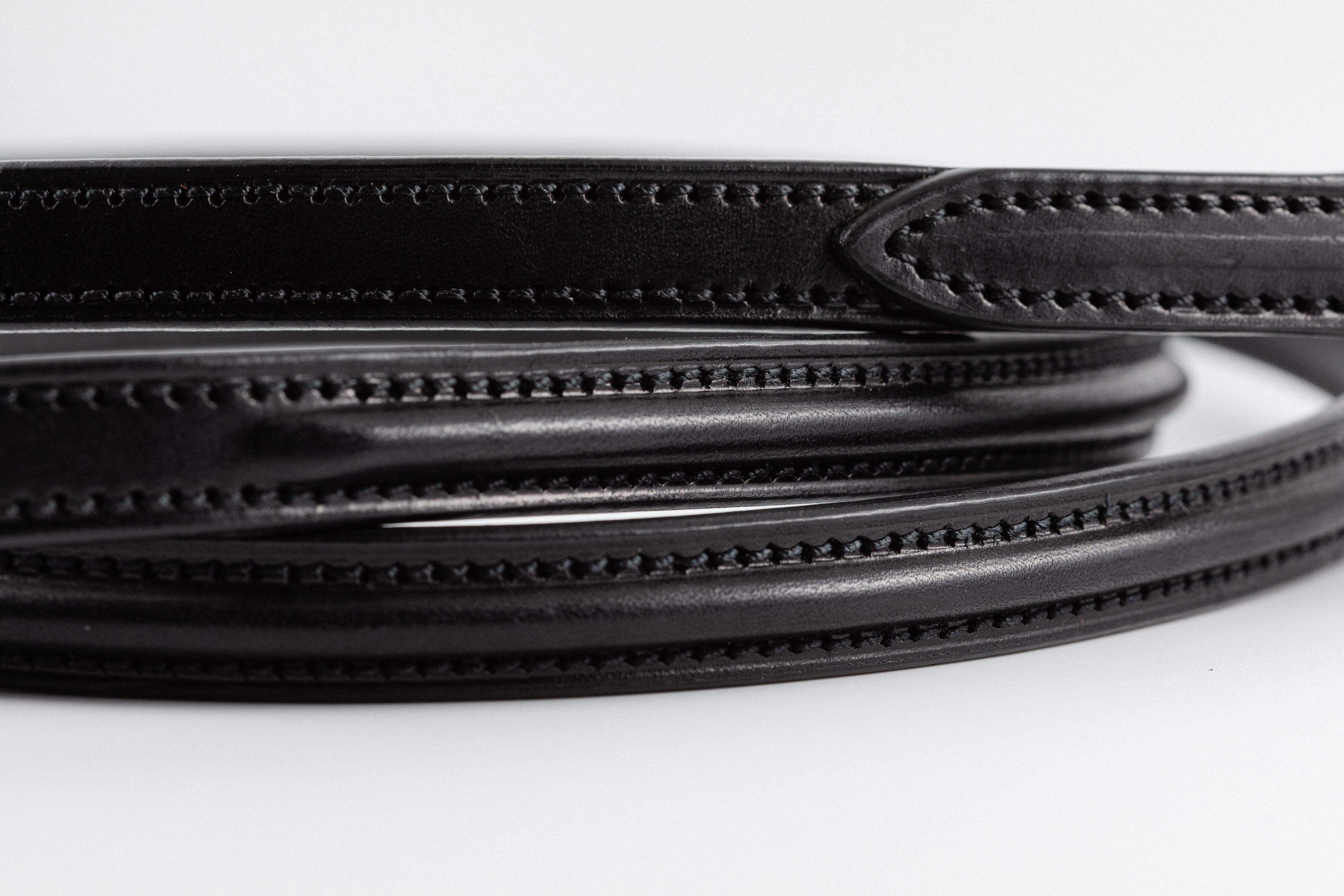 Close up of the Raised Dog Leash showing gold clasp and detailed stitching.