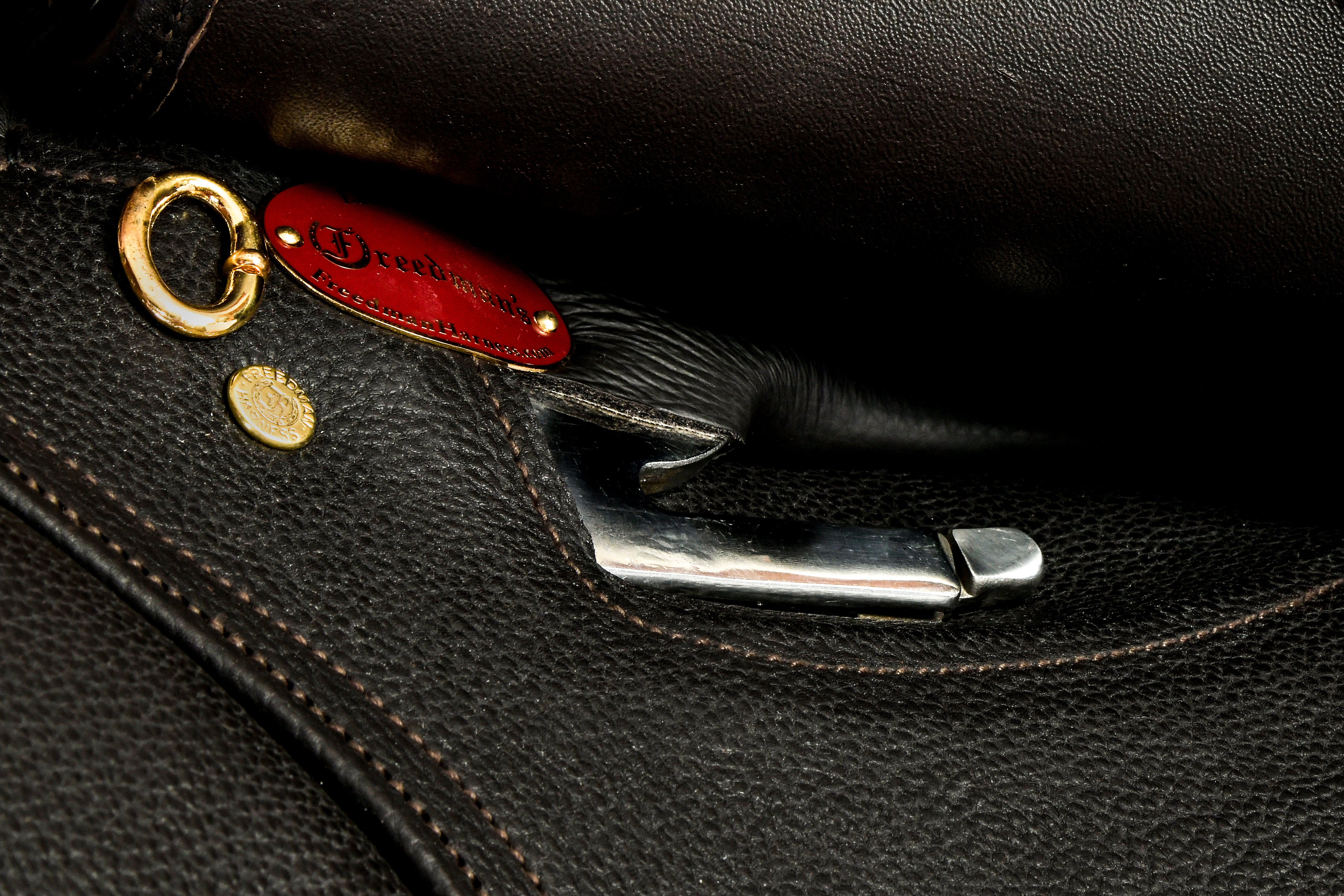 Close-up of Hunter SG saddle hardware and branding.