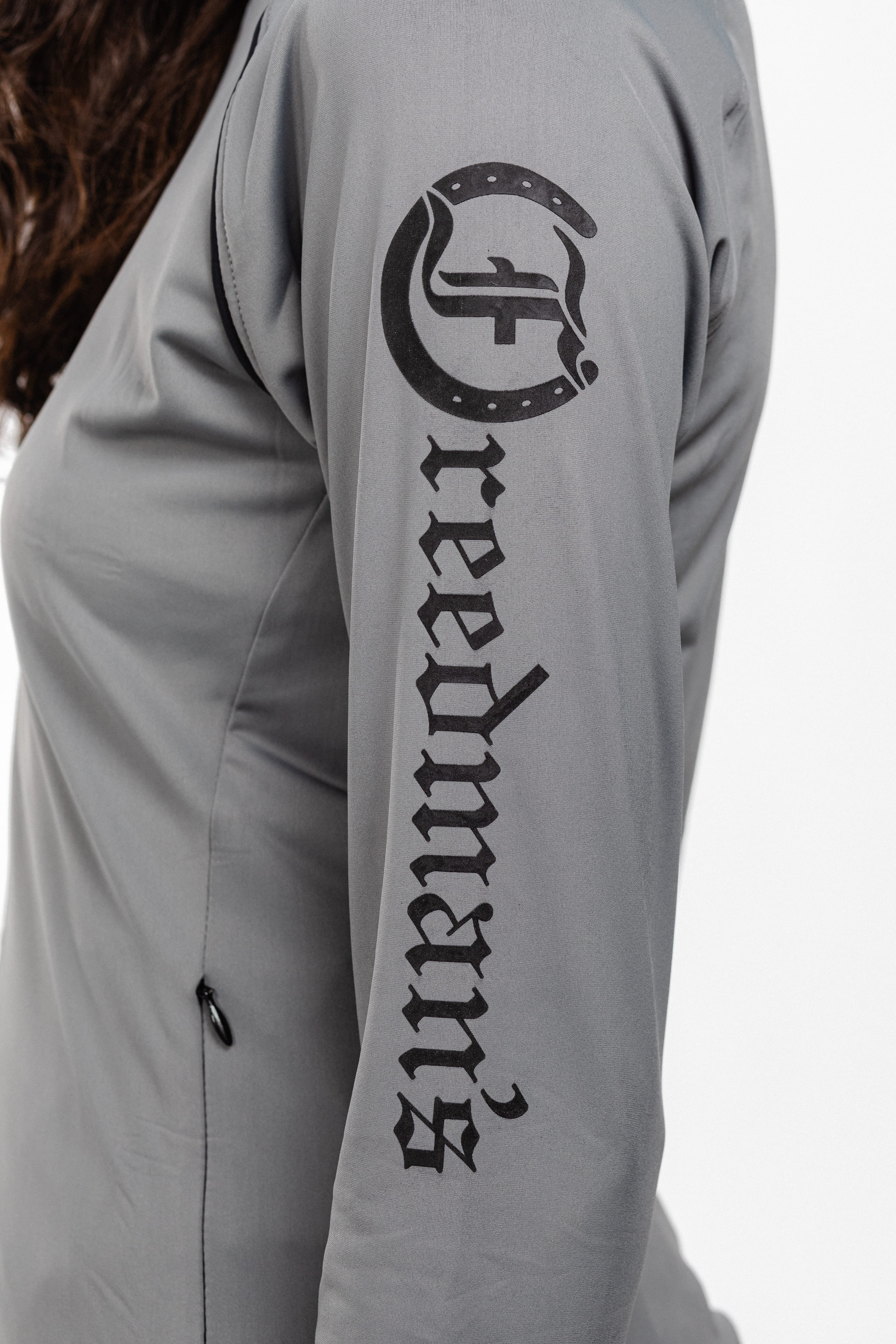 Close-up of Ladies Arum Jacket Back Showing Freedman's Logo and Arm Detail.