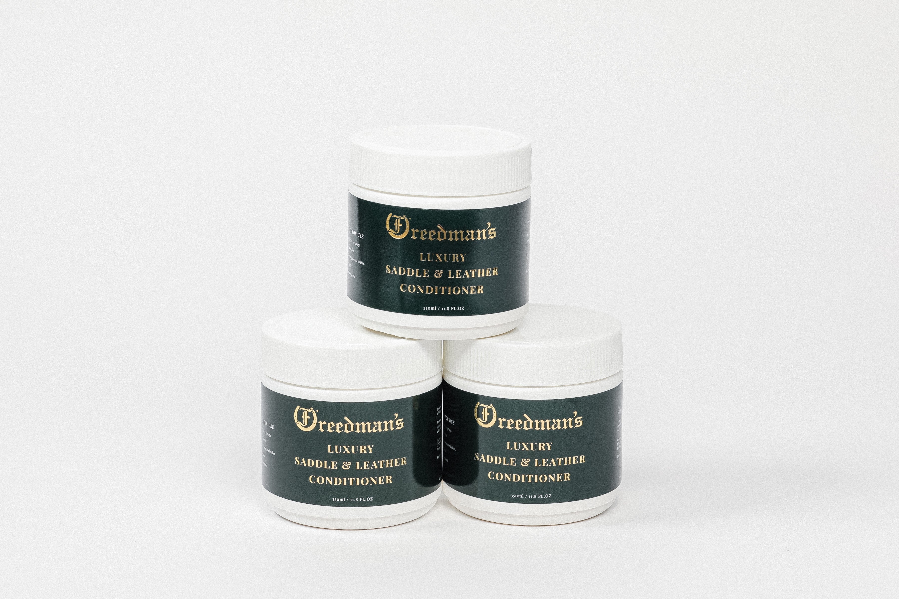 Freedman's Luxury Saddle & Leather Conditioner: Three Jars Stacked in a Pyramid on a White Background