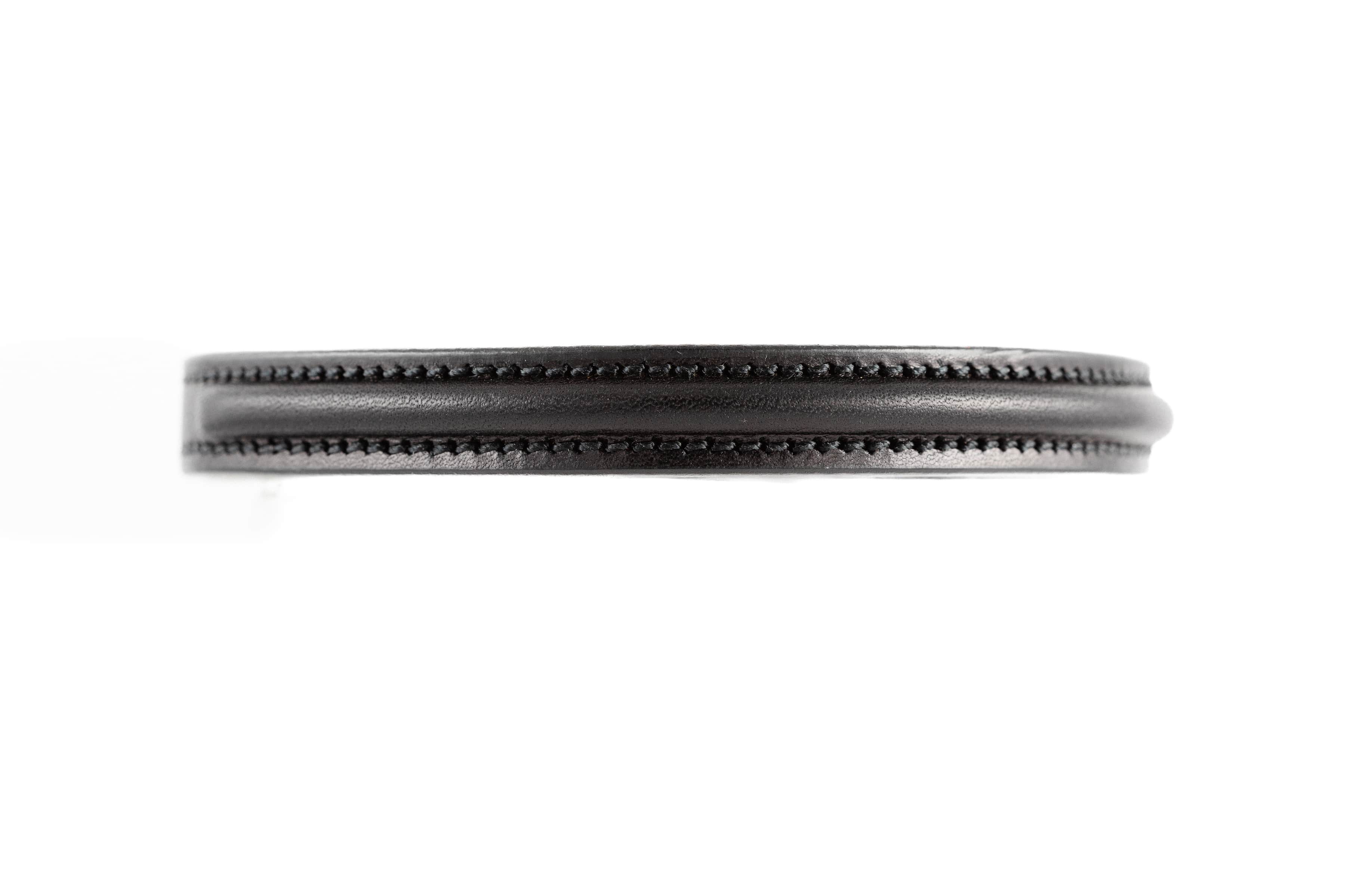Close-up of black leather Raised Dog Collar showing detailed stitching on white background.
