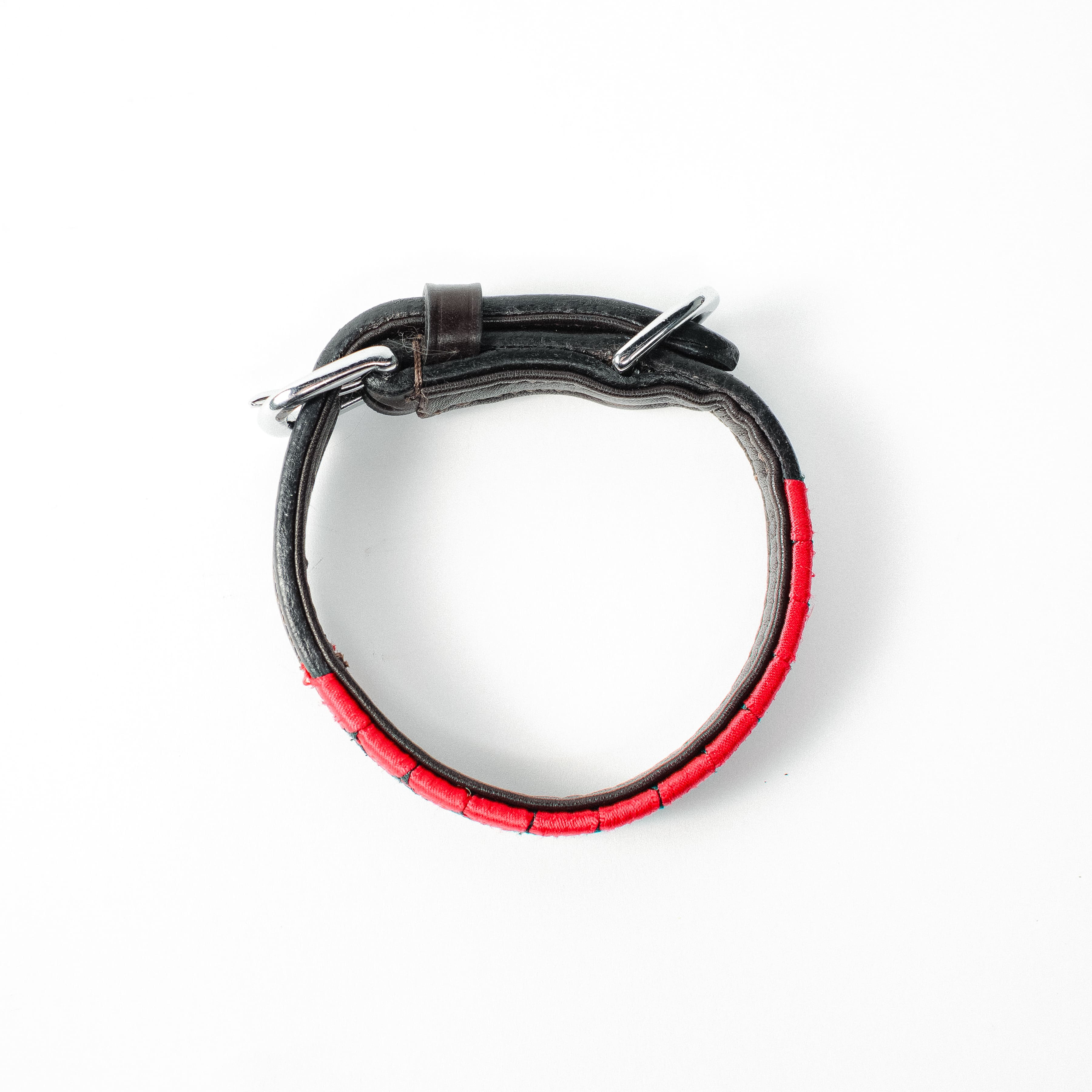 Satin Red and Black Weaved Dog Collar with leather and silver hardware, shown from above on a white background.