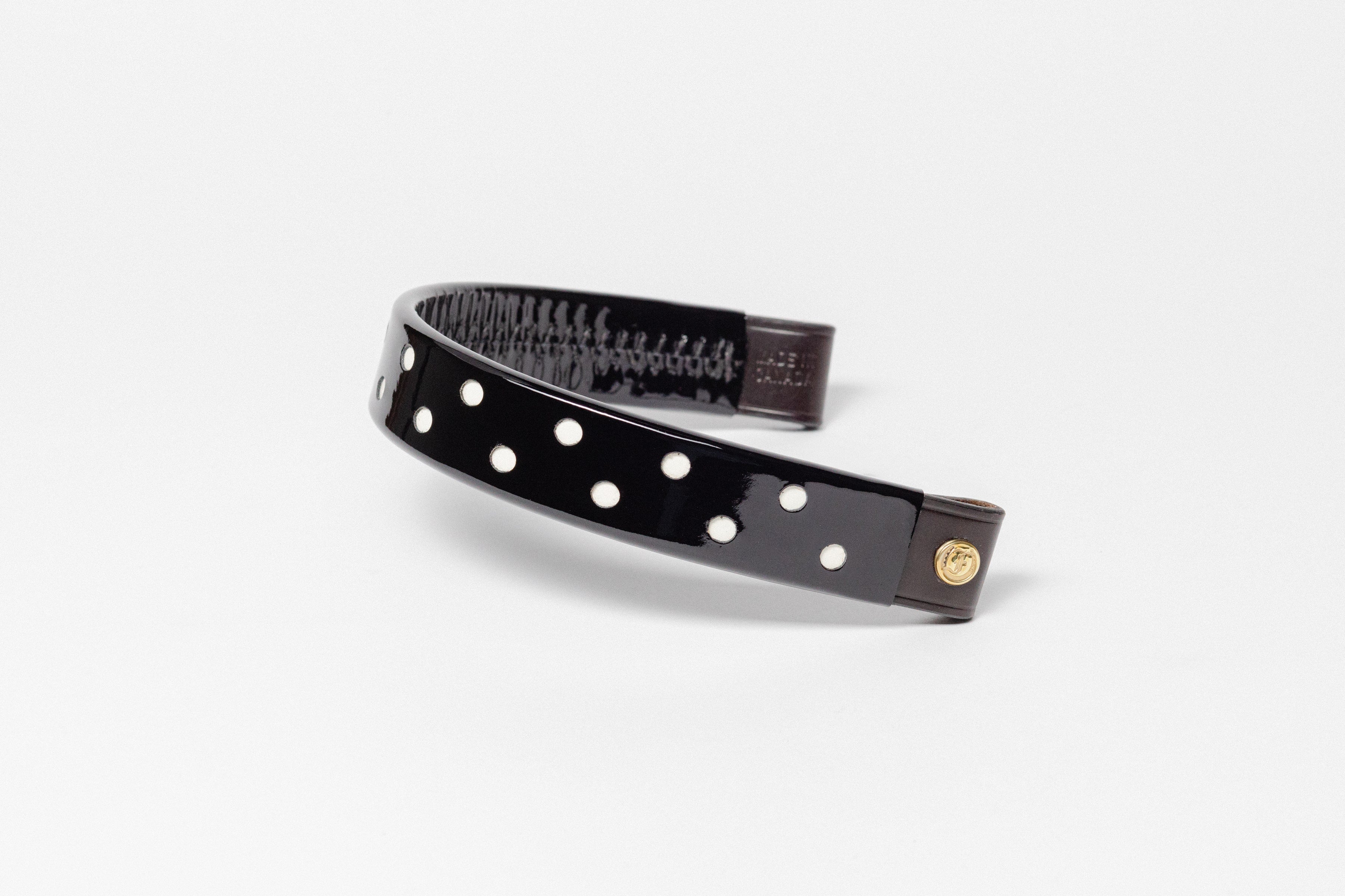 Wide Tapered turned edge black patent leather  browband with small white dots and brown ends.