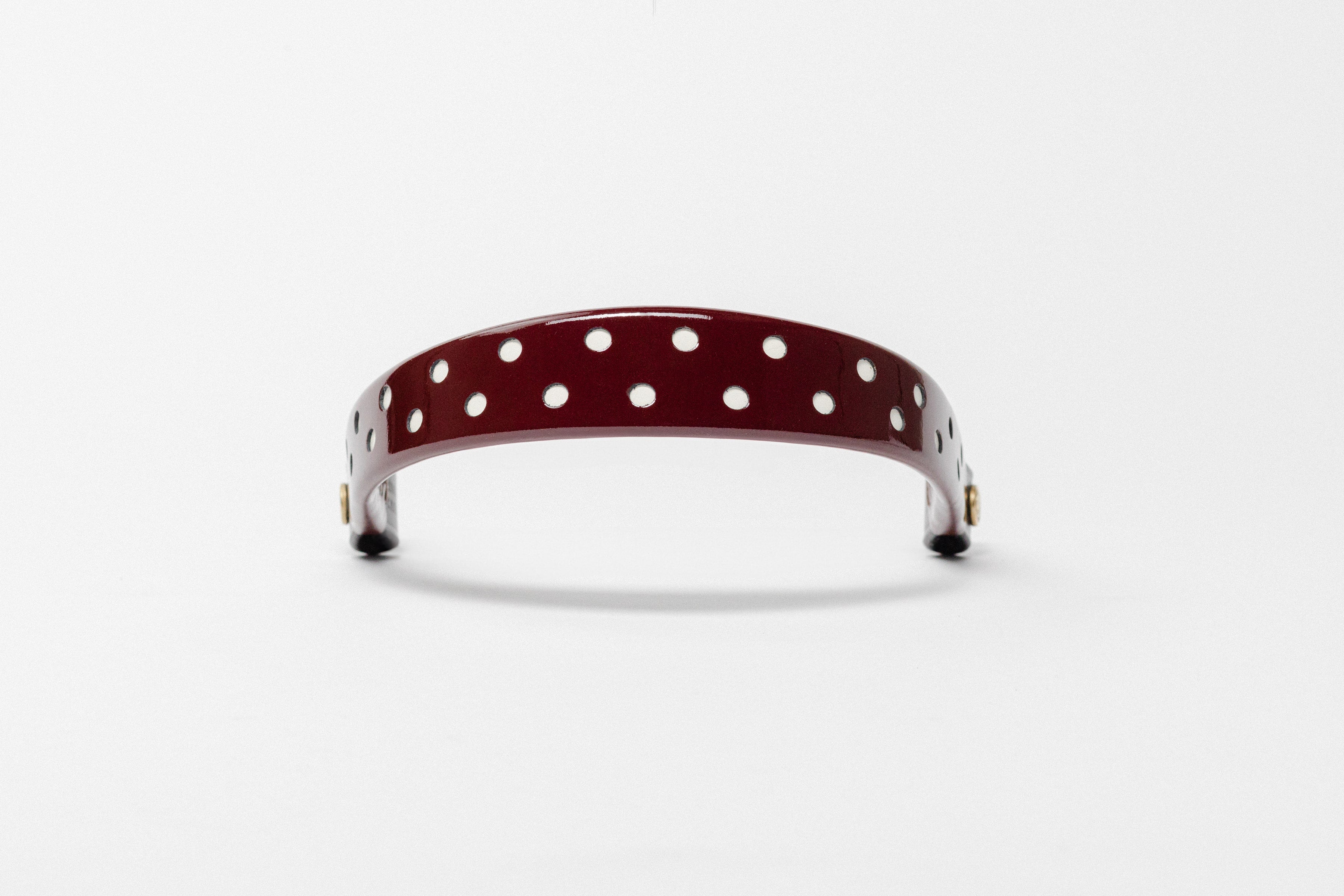 Burgundy Patent Leather Browband with white dots, wide tapered design, dark leather ends, frontal view.