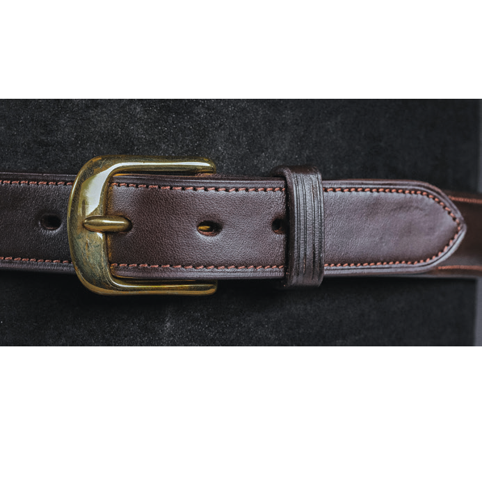 Close-up of Raised Custom Name Plate Belt in dark brown leather with brass buckle and stitched detail.