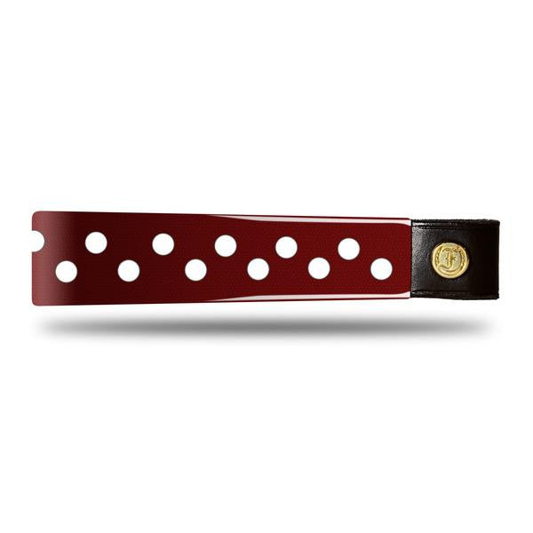 Burgundy Patent Leather Browband with small white dots, wide tapered design, polished brass Freedman logo buttons, and dark leather ends, laid flat.