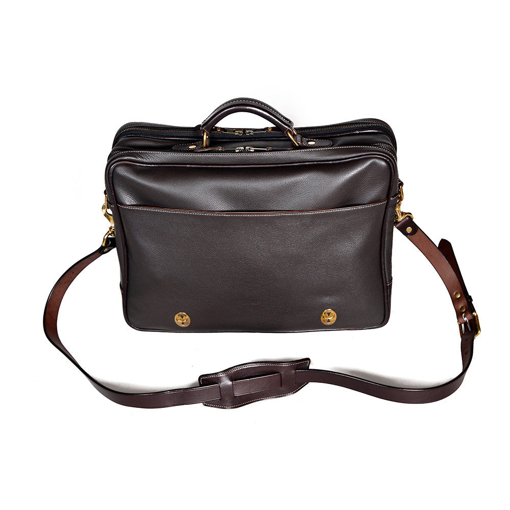 Dark Brown leather briefcase, Wagonette model, with front slip pocket, silver hardware, and detachable shoulder strap.