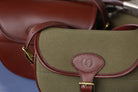Close-up of the Military Green Ashcombe Cartridge Bag with Havana brown leather trim and embossed “F” logo, made by Freedman’s Harness.