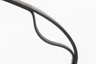 Detail of a high-quality black leather strap, highlighting the supple texture and precise edge finishing, suitable for equestrian or leather goods context.