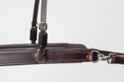  Close-up of an ACTraining Breast Collar and Neck Strap component, showing brown leather construction, buckles, rings, stitching, and a snap or clip, isolated on a white background.