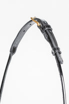 Zoomed-in view of the buckle and strap detail on an Arabian Show Cable Halter.