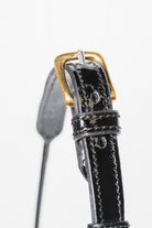  Zoomed-in view of the buckle and strap detail on an Arabian Show Cable Halter. - side top view.