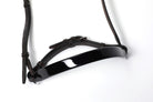 Close-up of Black patent leather Show Cavesons with black leather straps, displayed on a white background.
