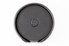 Freedman's Coaster Set in Holder: Black Leather Coasters with Embossed Freedman’s Logo in Center, Close-Up View