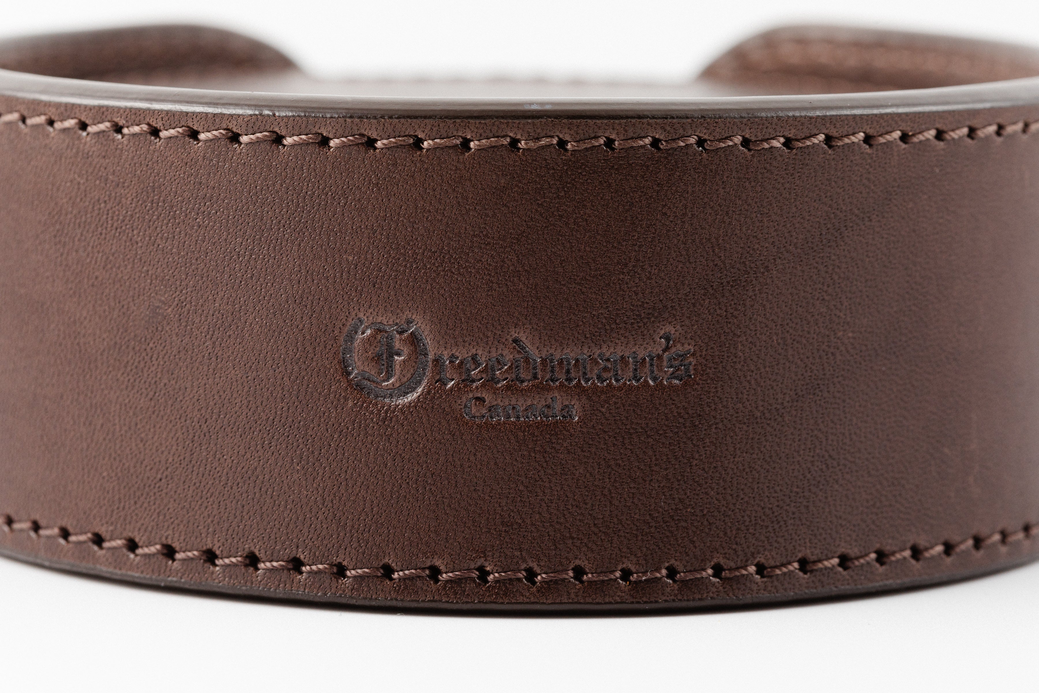 Set of Brown Leather Coasters in Holder by Freedman's, Each Coaster Features Distinctive Logo and "Canada" Marking