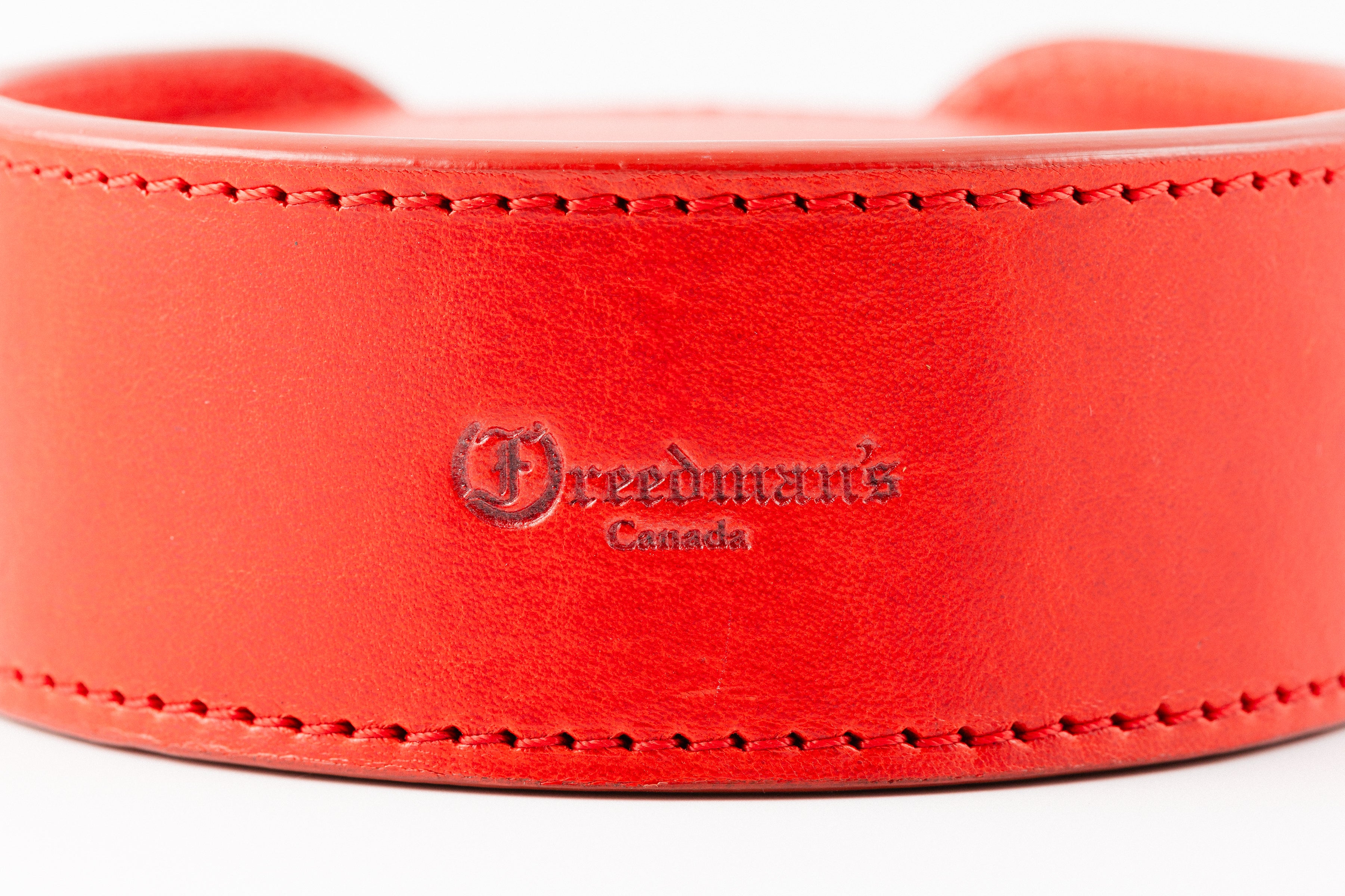 Set of Red Leather Coasters in Holder by Freedman's, Each Coaster Features Distinctive Logo and "Canada" Marking