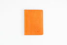 Freedman's Credit Card Holder: Slim and Durable Wallet, Close-Up on Leather Texture and Stitching- Orange