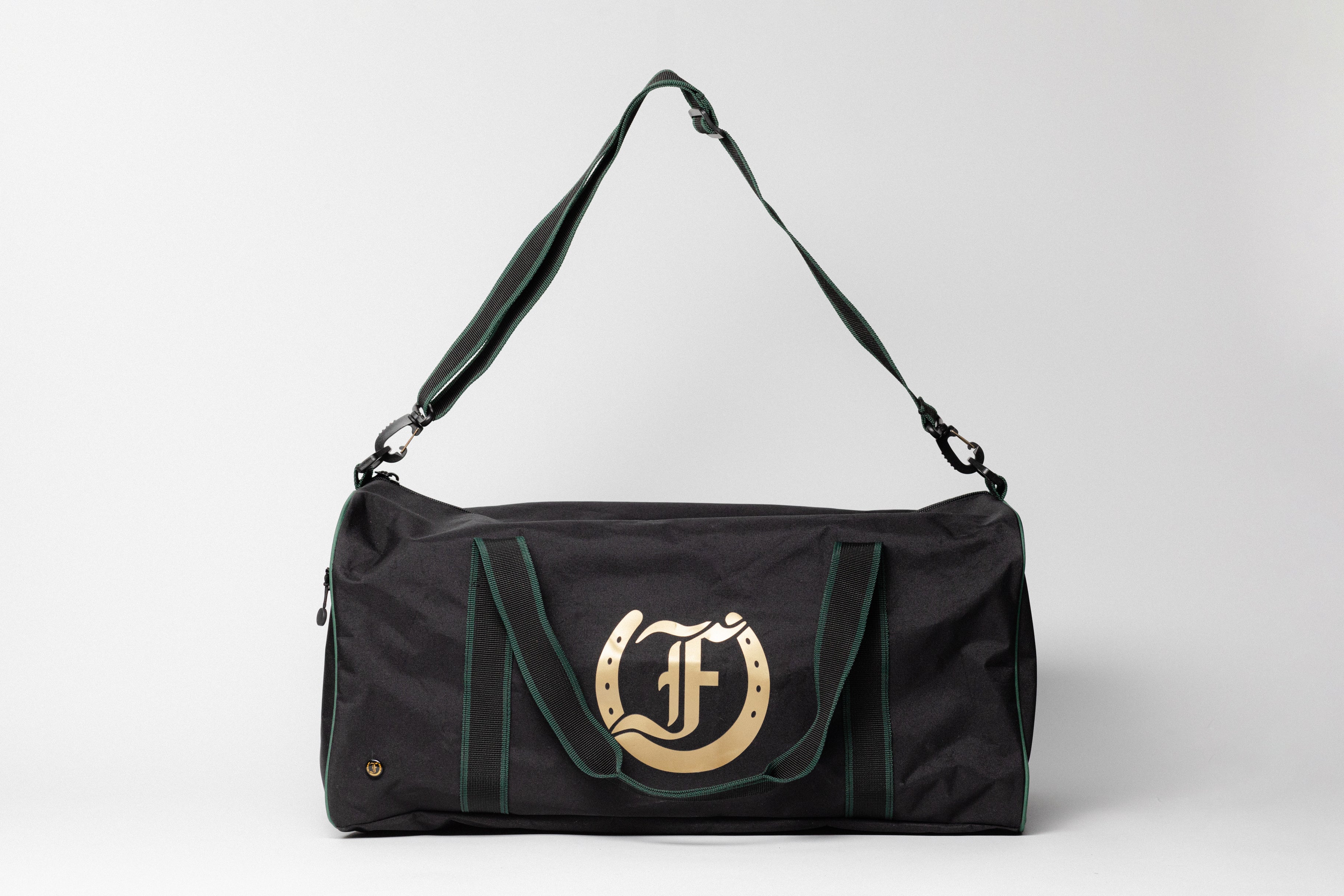 Team Freedman's Duffel Bag, black with gold logo and shoulder strap.