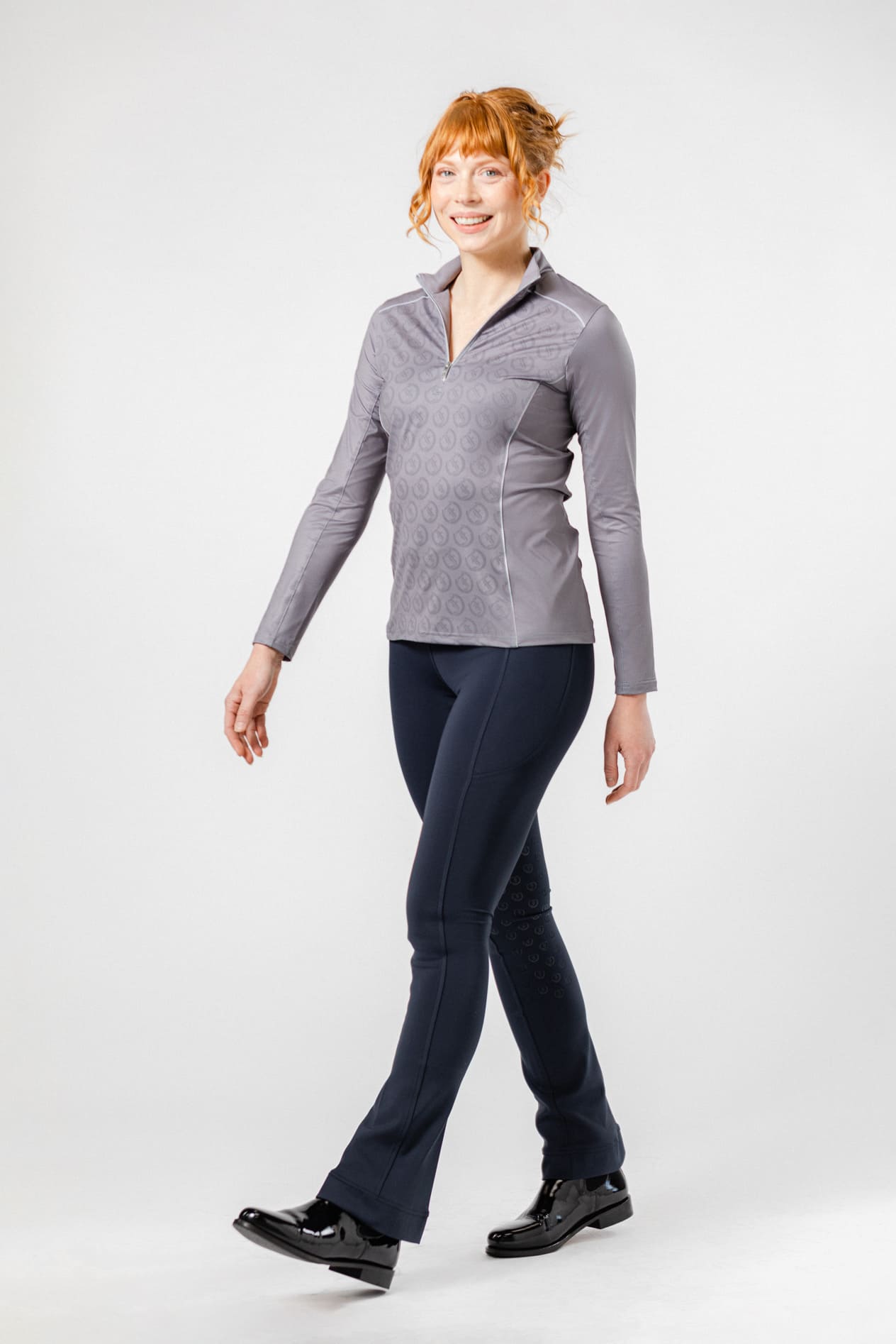 Woman Modeling Complete Freedman's Equestrian Look: Platinum Echo Shirt, Navy Jods, and Jodhpur Boots