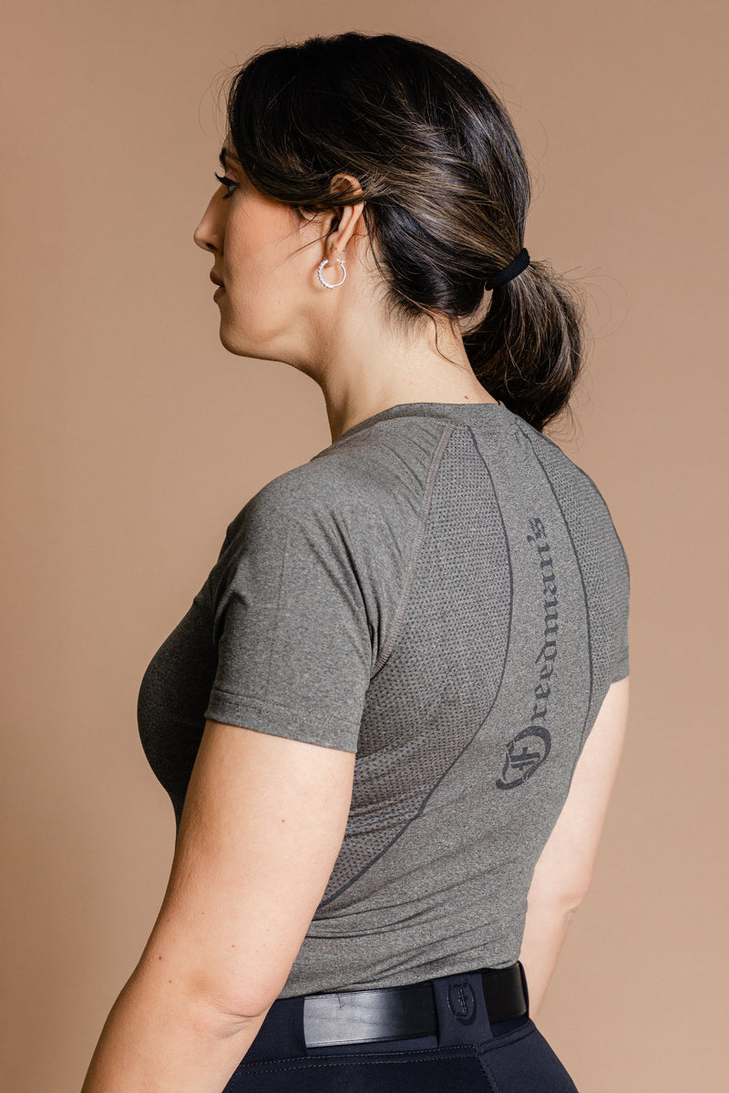 Ash grey Ladies' Tous les Jours Essential V Neck Tee Shirt, side view showcasing the relaxed fit and "Freedman's" print on the upper center back.