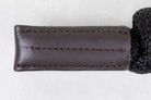 Brown leather case with stitching detail on a white background