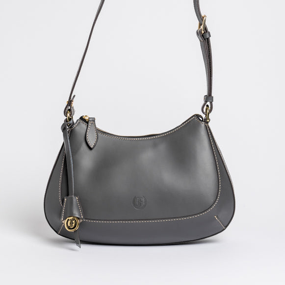 Carlisle Bag in grey leather by Freedman Harness – sleek crossbody handbag with gold hardware, contrast stitching, and adjustable shoulder strap