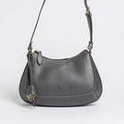 Carlisle Bag in grey leather by Freedman Harness – sleek crossbody handbag with gold hardware, contrast stitching, and adjustable shoulder strap