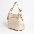 Side view of Wetherby Tote by Freedman Harness – Putty leather shoulder bag with adjustable strap, gold buckle hardware, and sleek minimalist design